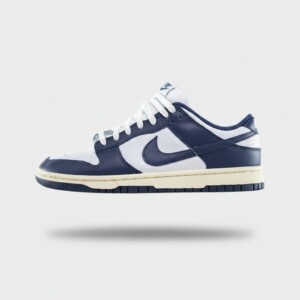 Sneakersy Nike Dunk Low Vintage Navy, unisex, skóra naturalna, nylonowy język, perforacje, podeszwa pivot circle, FN7197-100